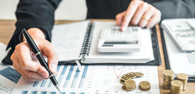 Business man Accounting Calculating Cost Economic budget investment and saving concept