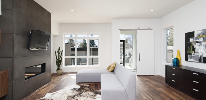 A beautiful interior shot of a modern house with white relaxing walls and furniture and technology